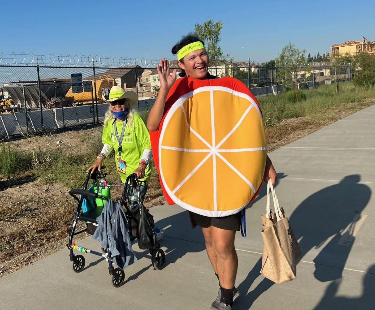 Fontana Walks participant walking with HF staff in costume
